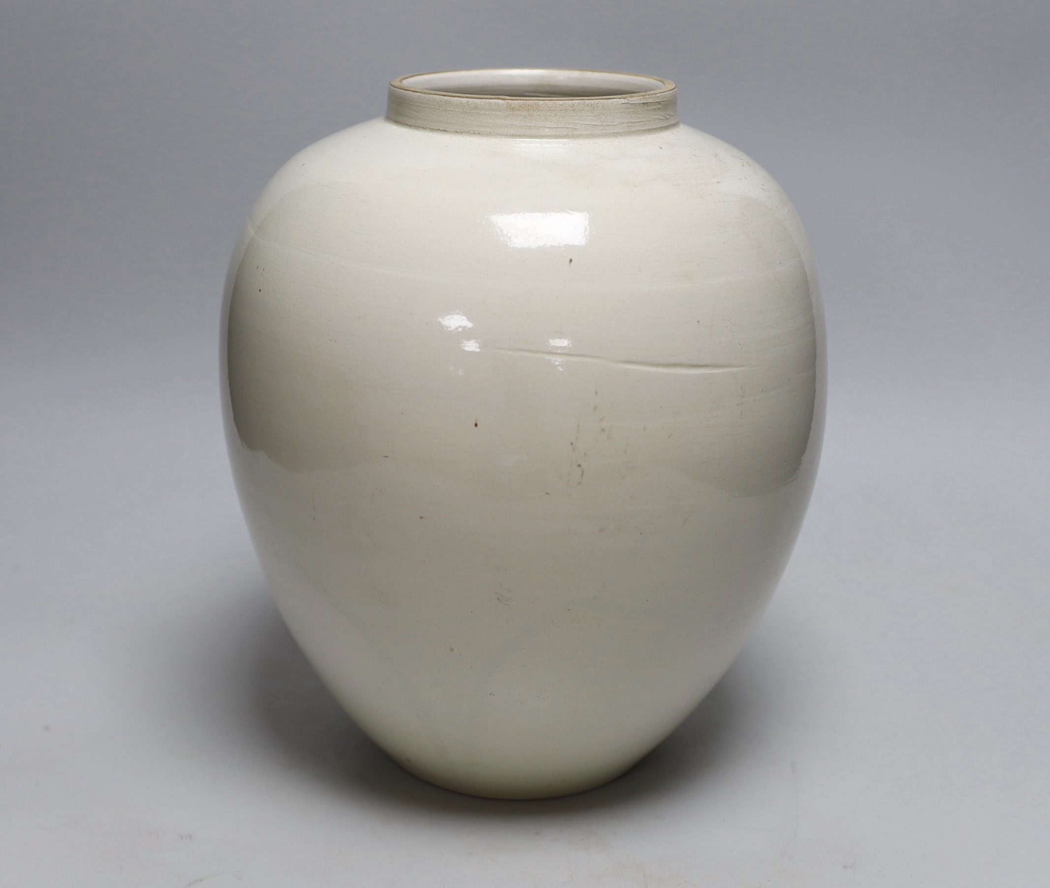 A Delft tobacco jar hand-painted with two figures, 28cm high